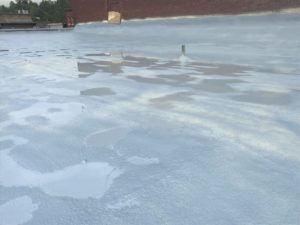 new roof coating in the rain